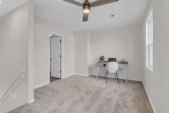 unfurnished office with light colored carpet and ceiling fan