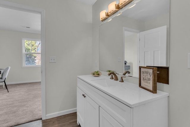 bathroom featuring hardwood / wood-style floors and vanity