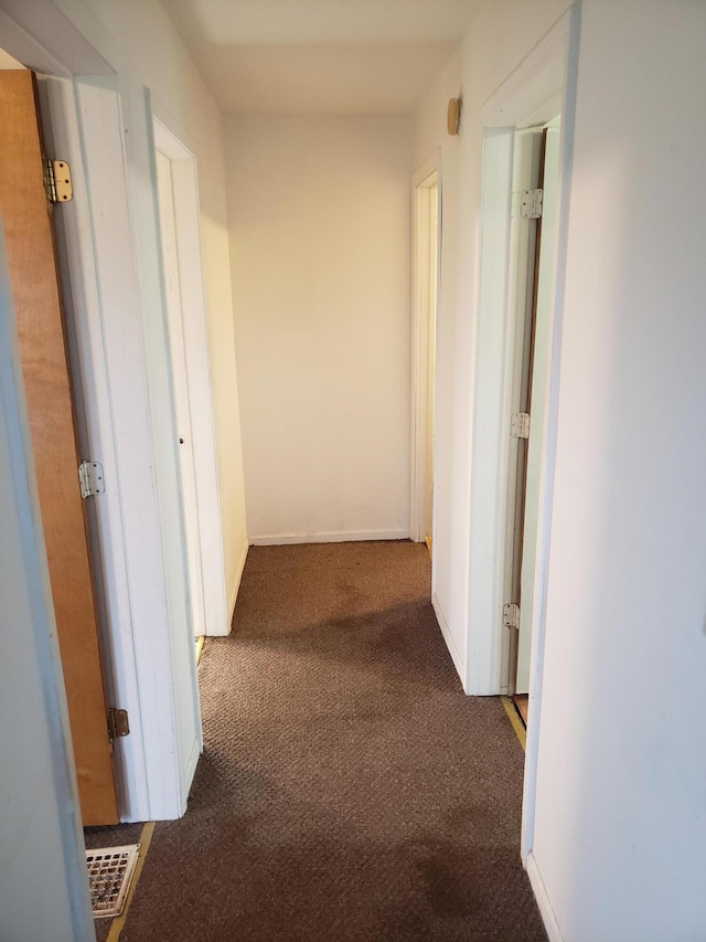 hall with carpet flooring