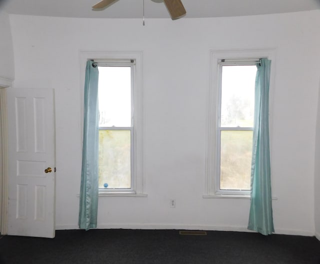 spare room with ceiling fan