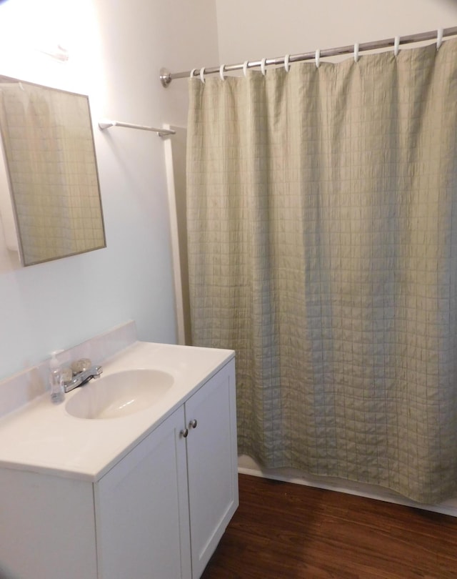 bathroom with vanity and wood-type flooring