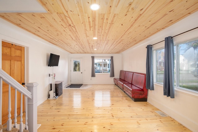 entrance foyer featuring wood ceiling and light hardwood / wood-style flooring