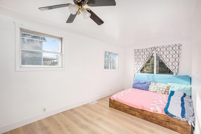 bedroom featuring wood-type flooring and ceiling fan