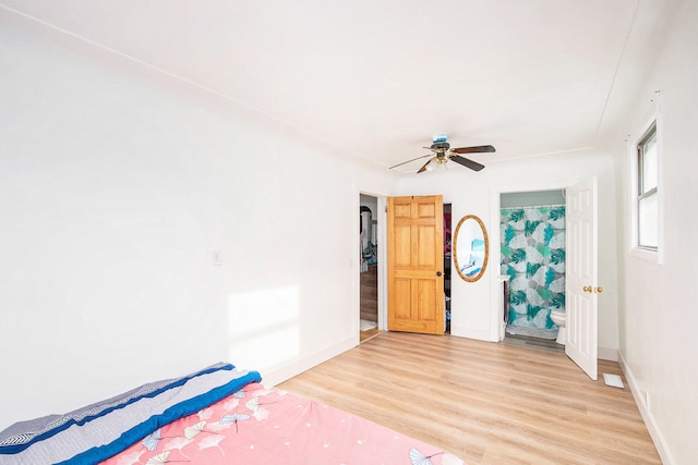 unfurnished bedroom featuring ceiling fan and light wood-type flooring