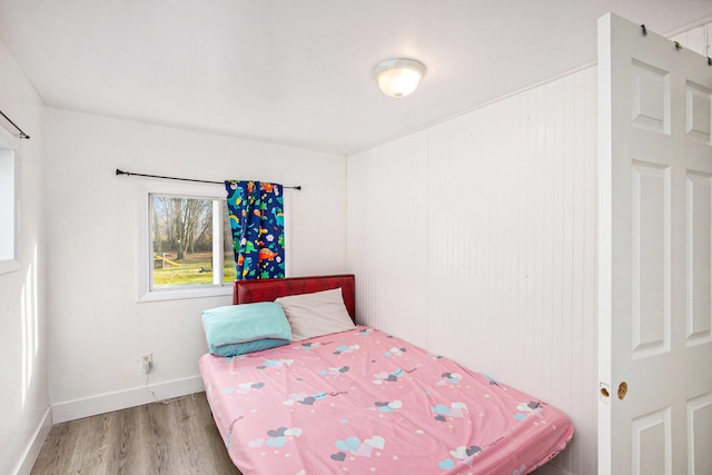 bedroom with wood-type flooring