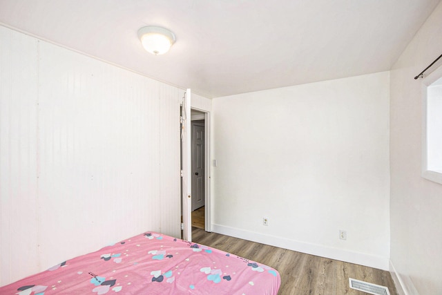 unfurnished bedroom featuring hardwood / wood-style flooring