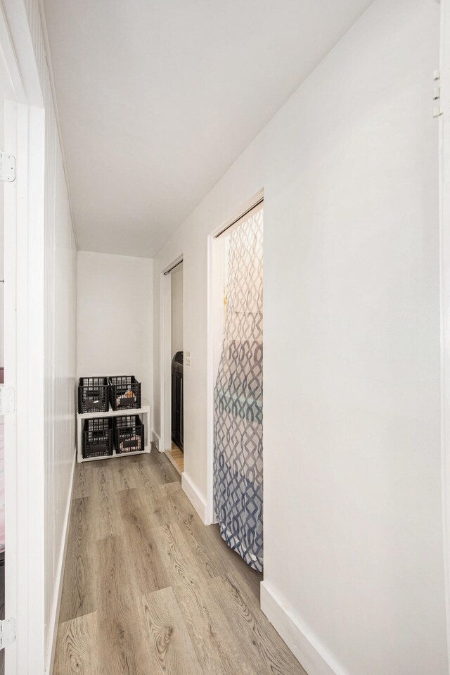 corridor featuring light wood-type flooring