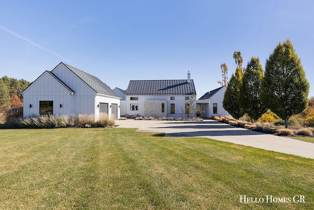 rear view of house with a lawn