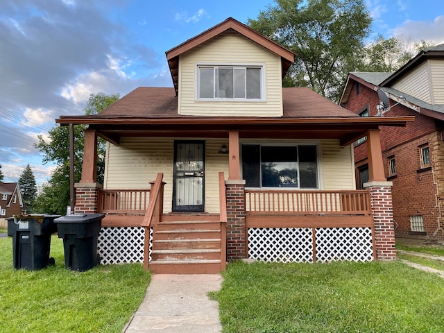 view of front facade with a porch and a front yard