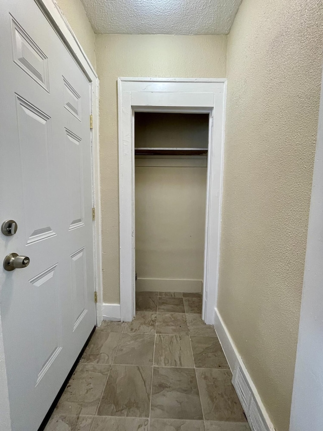 interior space featuring a textured ceiling