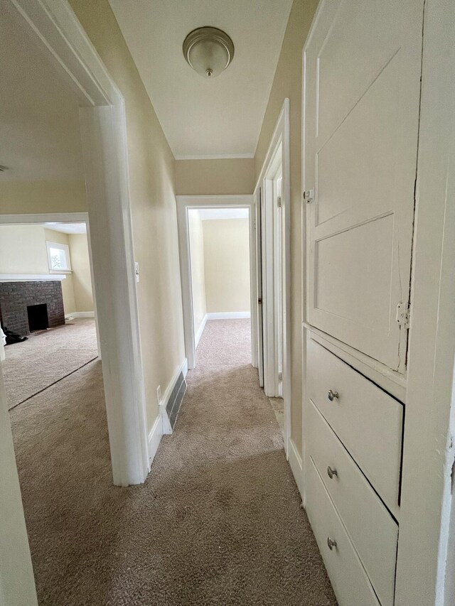 corridor with light colored carpet