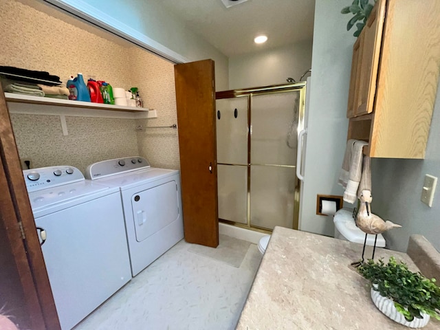 washroom featuring washing machine and clothes dryer