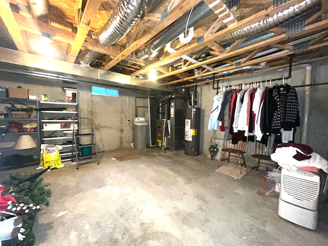 basement featuring heating unit and water heater