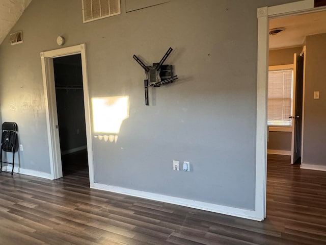 empty room with dark wood-type flooring