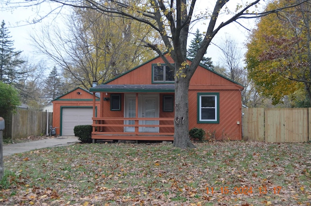 view of front of home with covered porch and a garage