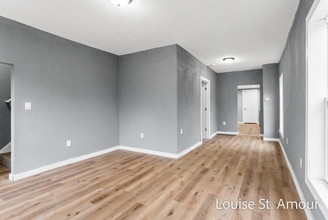 unfurnished living room with light wood-type flooring