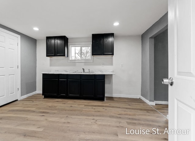 kitchen with sink and light hardwood / wood-style floors