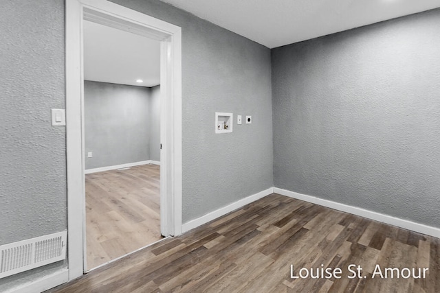unfurnished room with hardwood / wood-style flooring