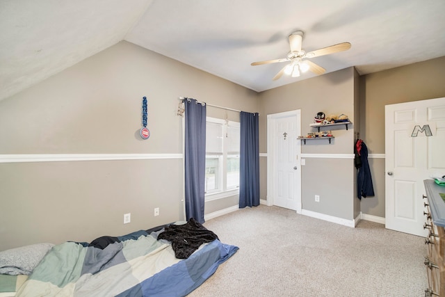 carpeted bedroom featuring ceiling fan and lofted ceiling