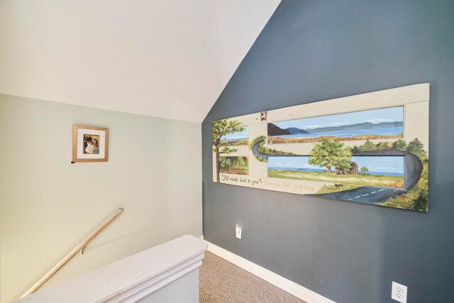 interior space with lofted ceiling and carpet floors