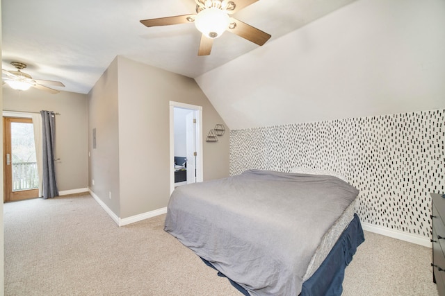 carpeted bedroom with ceiling fan and lofted ceiling