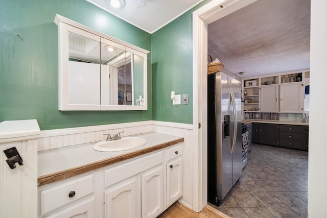 bathroom with tile patterned flooring and vanity