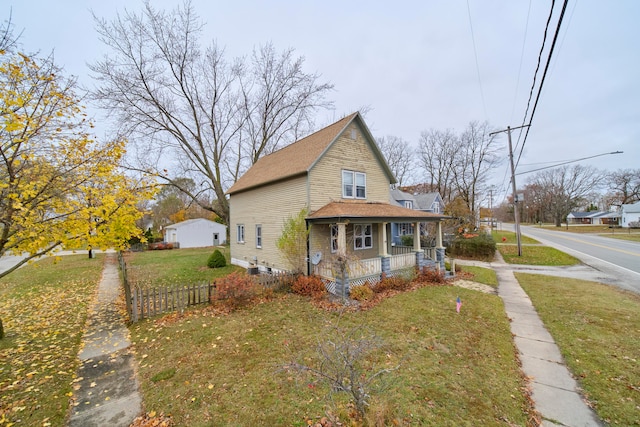 view of property exterior featuring covered porch and a yard