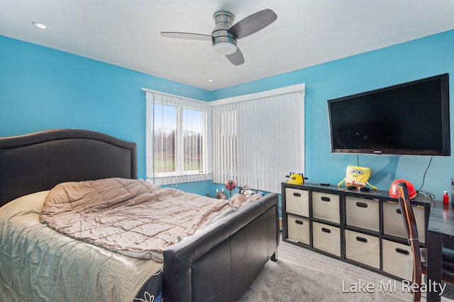 bedroom with ceiling fan and light colored carpet