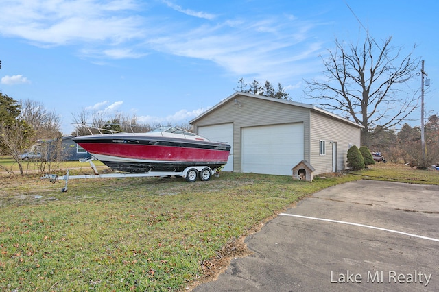 garage with a yard