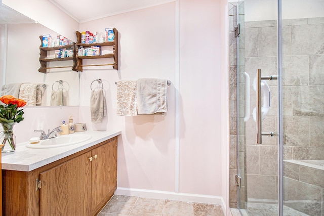 bathroom with tile patterned floors, vanity, ornamental molding, and walk in shower