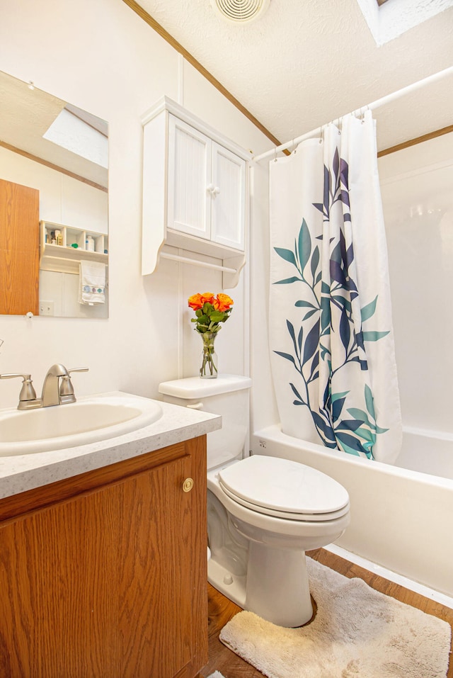 full bathroom with shower / bathtub combination with curtain, a textured ceiling, toilet, vanity, and hardwood / wood-style flooring