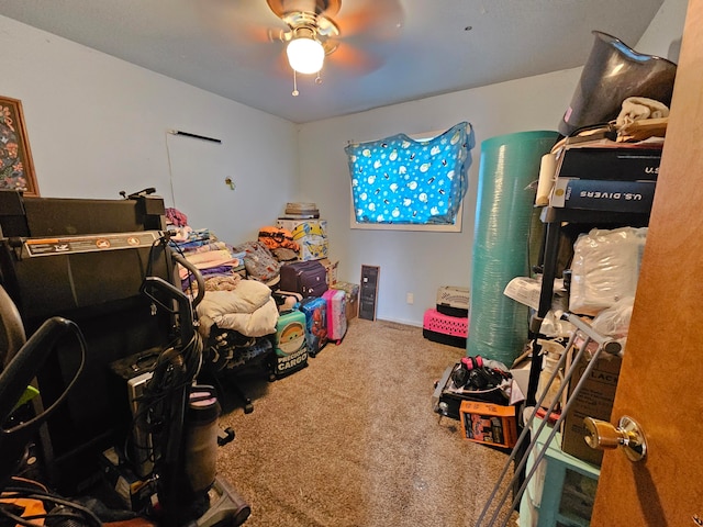 interior space with ceiling fan and carpet floors