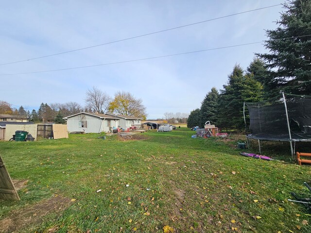 view of yard featuring a trampoline