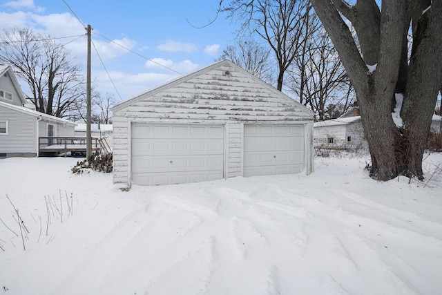 view of snow covered garage