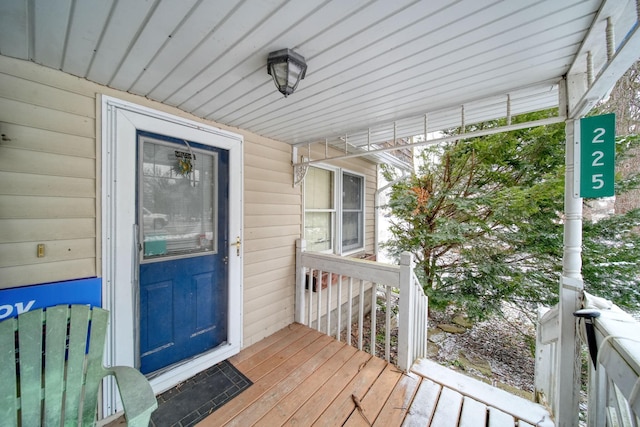 view of exterior entry with covered porch