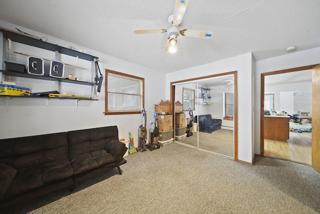 interior space featuring ceiling fan and a textured ceiling