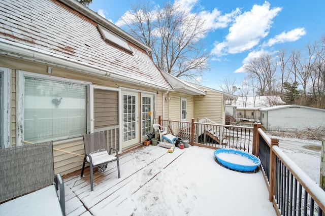 view of snow covered deck