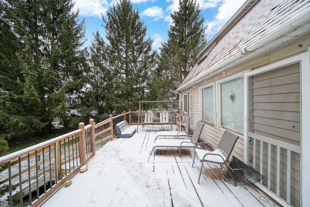 view of snow covered deck