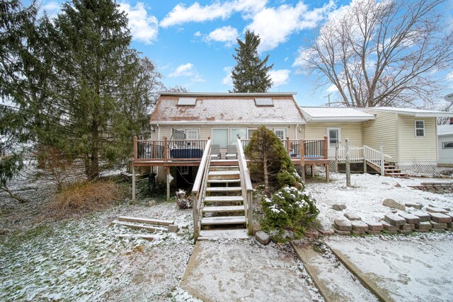 view of front of home featuring a wooden deck