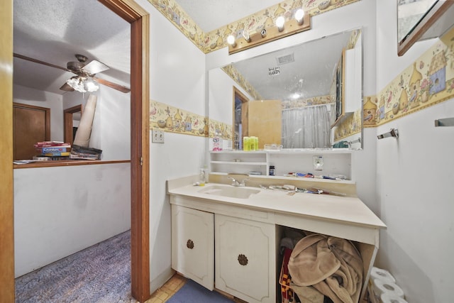 bathroom featuring ceiling fan and vanity