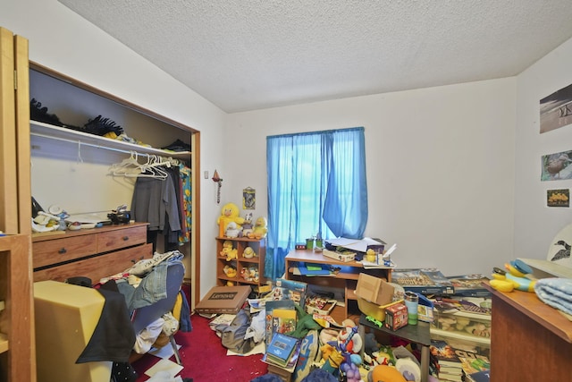 bedroom with a closet and a textured ceiling