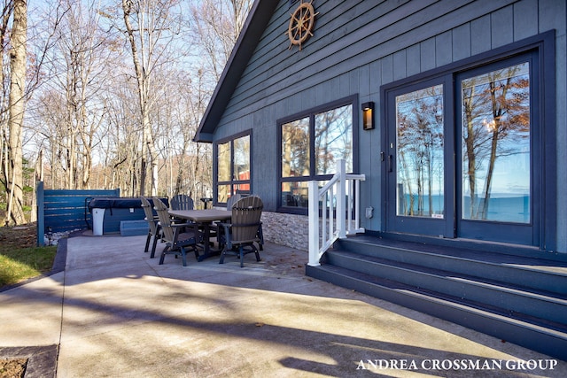 view of patio / terrace with a hot tub