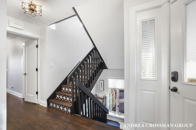 stairway featuring hardwood / wood-style floors