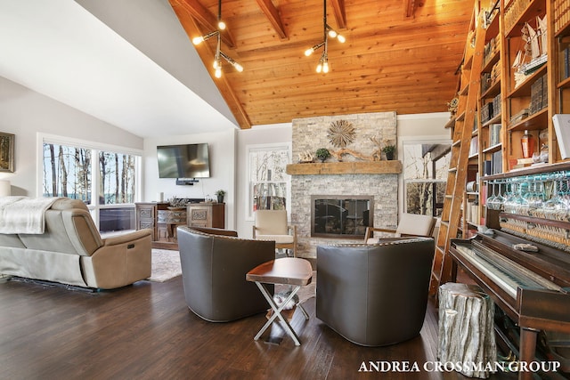 living room with rail lighting, wooden ceiling, beamed ceiling, a fireplace, and hardwood / wood-style flooring