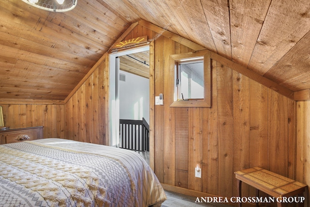 bedroom with wood ceiling, wooden walls, and vaulted ceiling