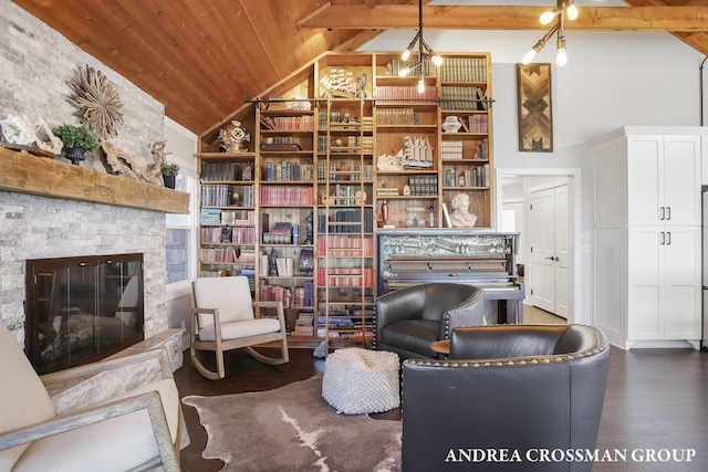 living area featuring dark hardwood / wood-style flooring, wooden ceiling, a fireplace, and high vaulted ceiling