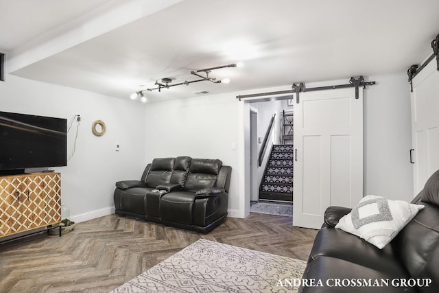 interior space featuring a barn door and parquet floors