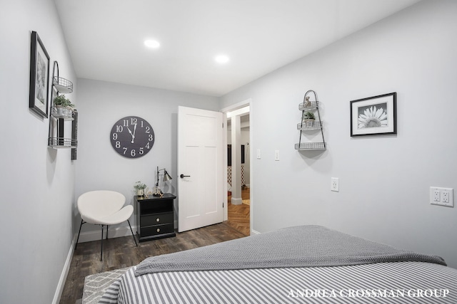 bedroom with dark wood-type flooring