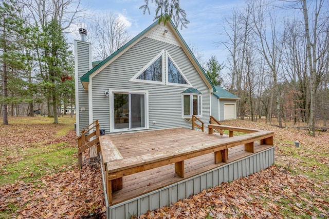 rear view of house with a wooden deck