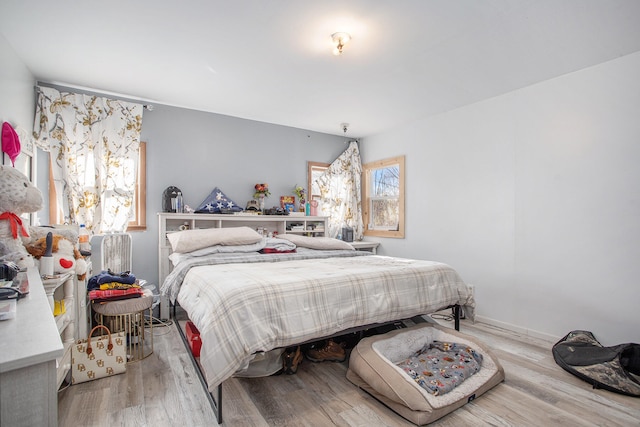 bedroom with light hardwood / wood-style floors